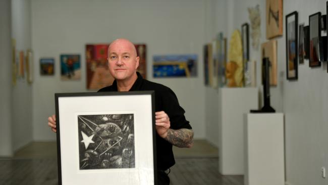 Townsville artist, tattooer and Veteran Rob Douma has been awarded the annual Umbrella Members Prize for a reflective self-portrait depicting his time on deployment in East Timor. Picture: Evan Morgan