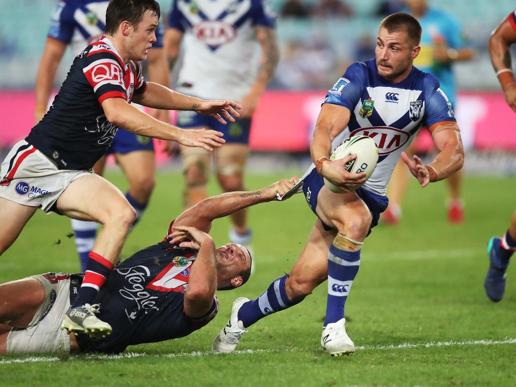 Bulldog's Kieran Foran tackled by Roosters' Boyd Cordner during NRL match between the Canterbury Bankstown Bulldogs and Sydney Roosters at ANZ Stadium. Picture. Phil Hillyard