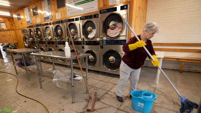 Flood clean-up in Lilydale on Main St and Williams St. Ann helps out cleaning up Lilydale laundromat after the flooding. Picture: Tony Gough