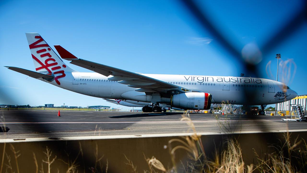 Virgin Australia aircraft parked on the tarmac at Brisbane Airport. Picture: Patrick Hamilton/AFP