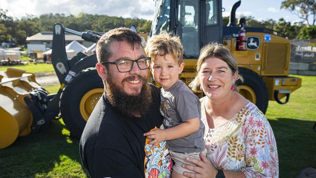 Mark and Penni Wick with son Banjo check out the earth moving equipment Toowoomba Royal Show, Thursday, April 18, 2024. Picture: Kevin Farmer