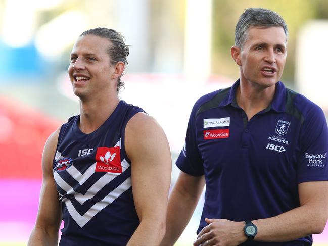 GOLD COAST, AUSTRALIA - JULY 11: Dockers coach Justin Longmuir and Nat Fyfe after winning the round 6 AFL match between the Fremantle Dockers and the St Kilda Saints at Metricon Stadium on July 11, 2020 in Gold Coast, Australia. (Photo by Chris Hyde/Getty Images)