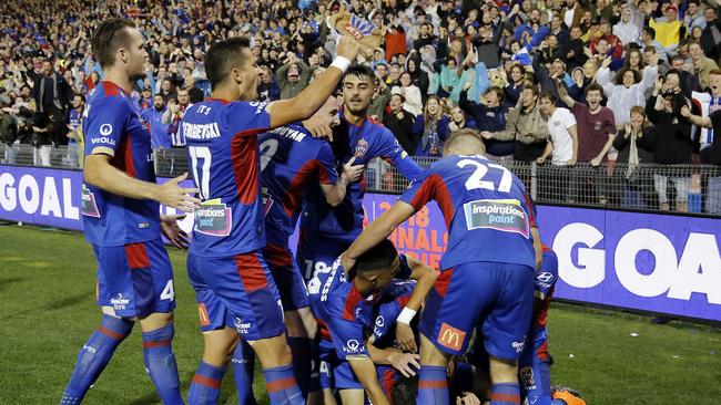 Newcastle Jets players celebrate Jason Hoffman’s goal in the semi-final against Melbourne City.