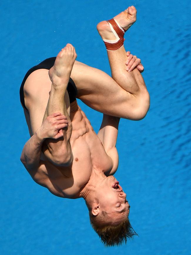 England’s Jack Laugher dives into his defence of his 1m springboard title. Photo: Getty Images