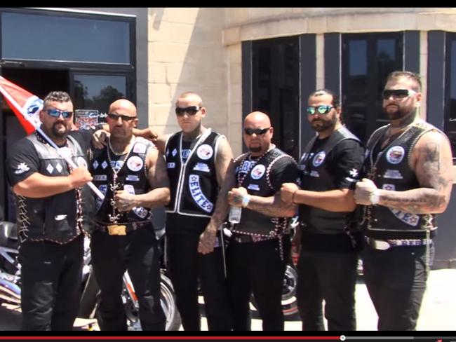 Rebels bike club president Damien Vella (second from left) and ex-member Chris Rymer (third from left). Picture: Supplied