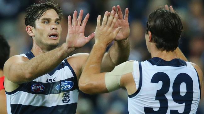 Tom Hawkins celebrates a goal with Shane Kersten. (Photo by Michael Dodge/Getty Images)