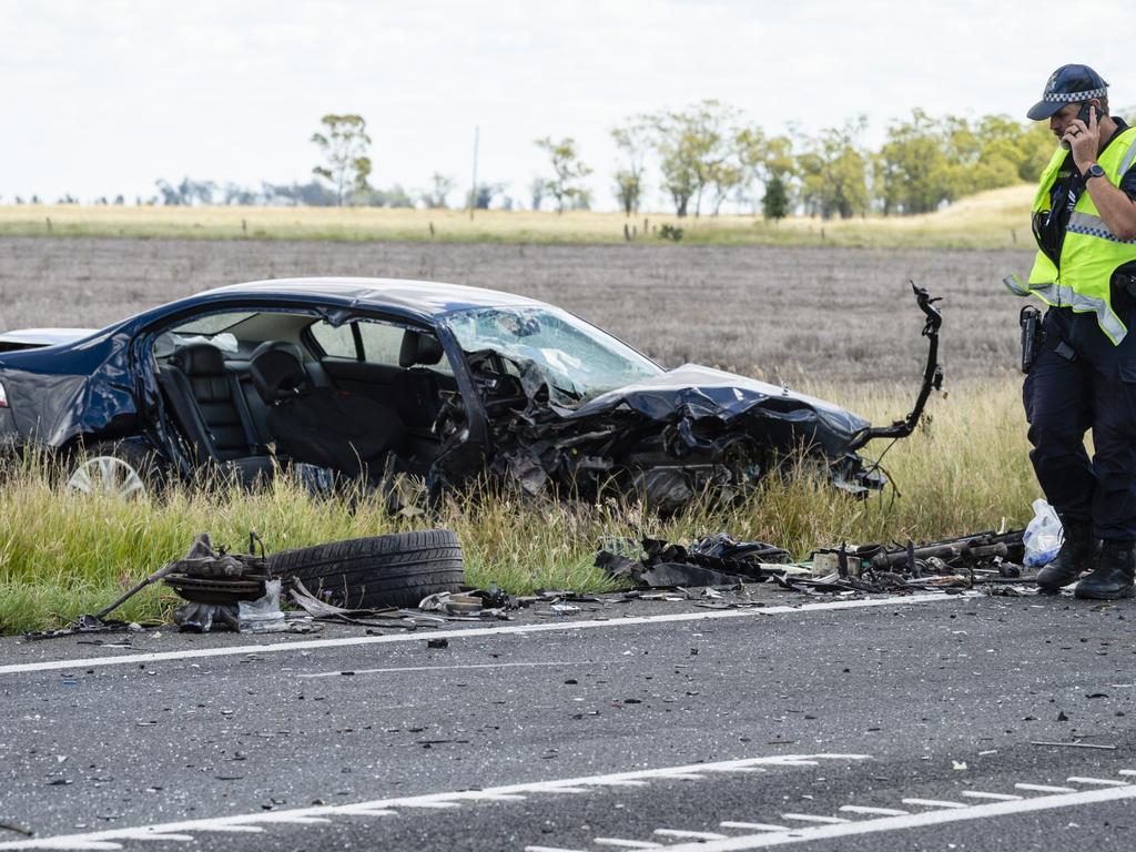 Emergency services at the scene of a fatal crash involving a truck and a car on the Warrego Hwy near Bowenville in February this year. Picture: Kevin Farmer