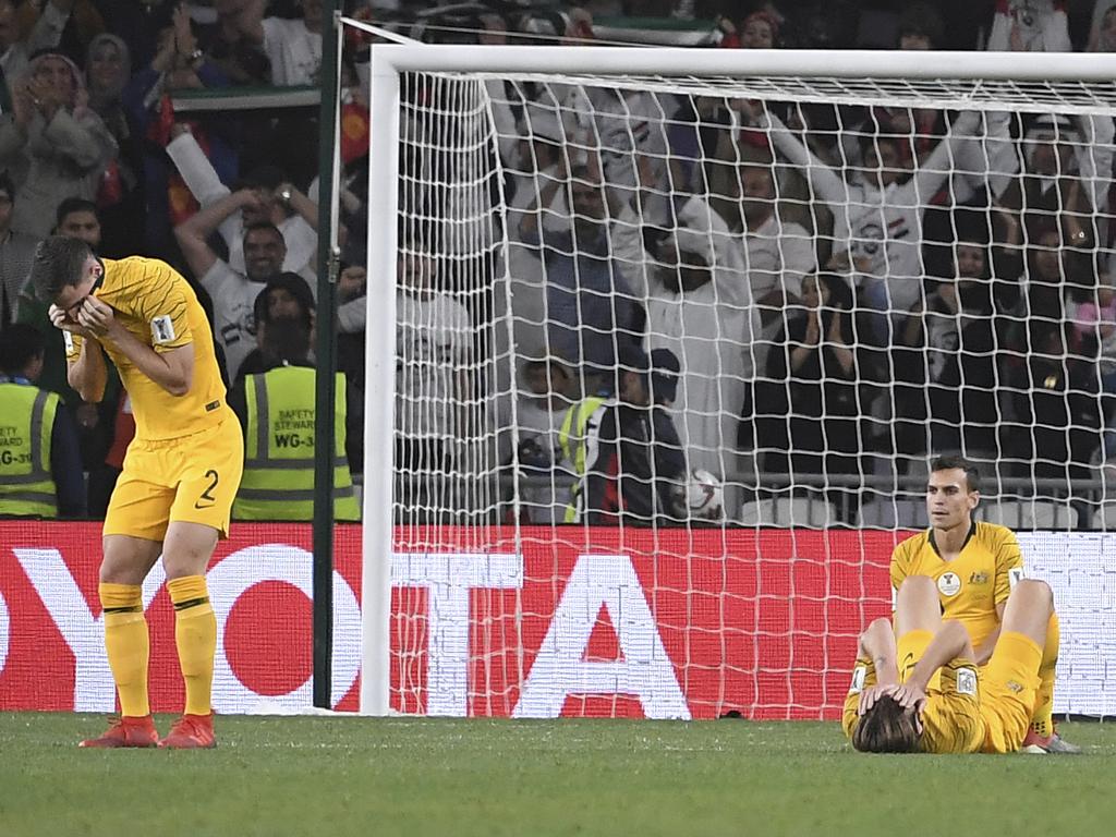 Australian players react after the AFC Asian Cup quarterfinal soccer match between United Arab Emirates and Australia at Hazza Bin Zayed Stadium in Al Ain, United Arab Emirates, Friday, Jan. 25, 2019. United Arab Emirates won the match 1-0. (AP Photo/Hassan Ammar)