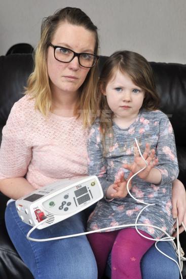 Phyllisity Ramm with her mum Kylie Purkis both from Chorley, Lancs., with an old monitor for Phyllisity that monitors her Central Sleep Apnoea each night which she is no longer eligible for. See ROSS PARRY story RPYSLEEP : The mum of a little girl who stops breathing up to 90 times a night is fighting to save her daughter’s life after she has lost the funding for a machine that monitors her sleep. Four-year-old Phyllisity Ramm suffers from a severe sleep condition which sees her having life-saving intervention as much as five times a night. Now mum Kylie Purkis has been dealt the devastating blow that she is no longer eligible for the equipment that monitors Phyllisity’s Central Sleep Apnoea each night, and has put the decision down to “NHS cuts”. 21 March 2018.