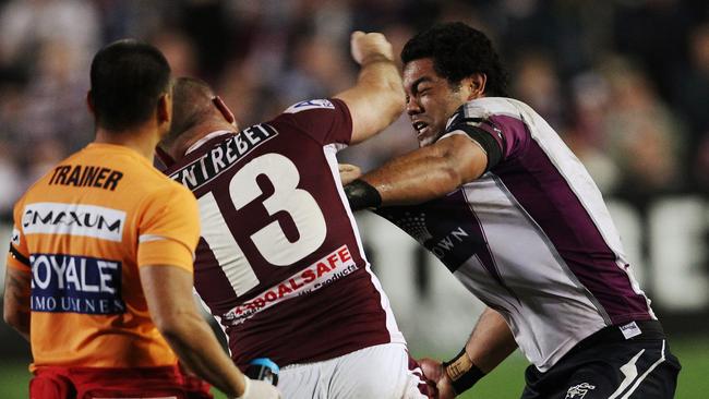 Glenn Stewart and Adam Blair continue their fight on the sideline after being sent to the sin bin in the 2011 battle of Brookvale. Picture: Brett Costello..