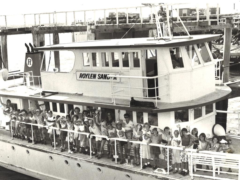 Grade 7 students from West Mackay State Primary School wave goodbye as they leave on the Roylen Sandra for a day trip to Brampton Island in March, 1981.