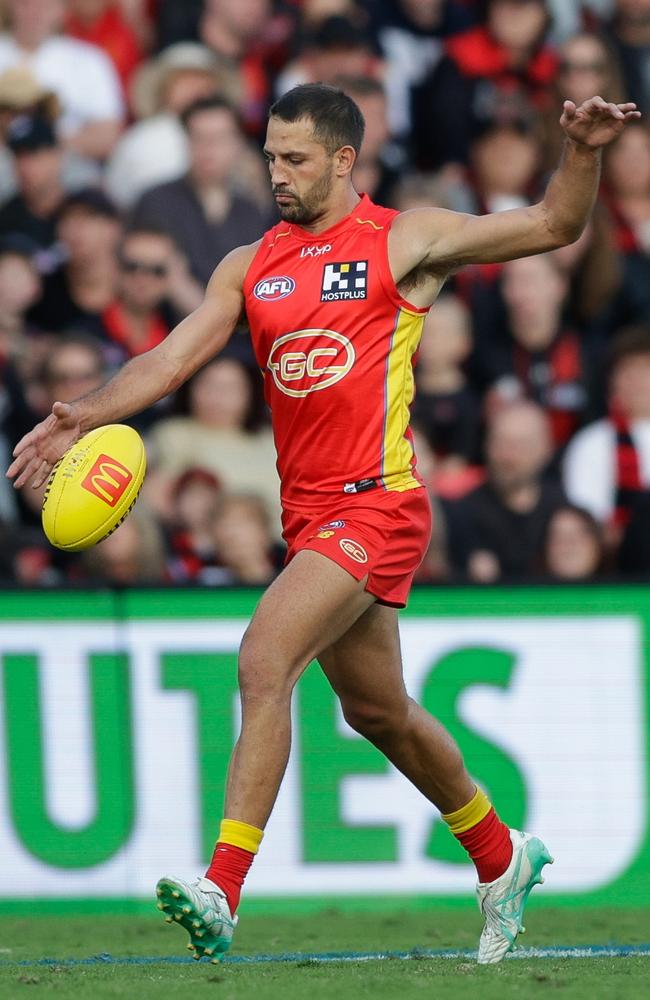 Ben Long of the Suns kicks a goal against the Essendon Bombers. Picture: Russell Freeman/AFL Photos via Getty Images.