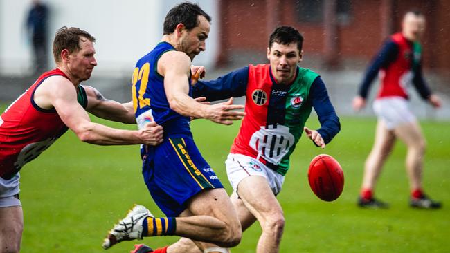 St Virgil’s playing coach Jaye Bowden in action in the Old Scholars grand final against OHA. Bowden took no part in the second half due to concussion. Picture: Linda Higginson