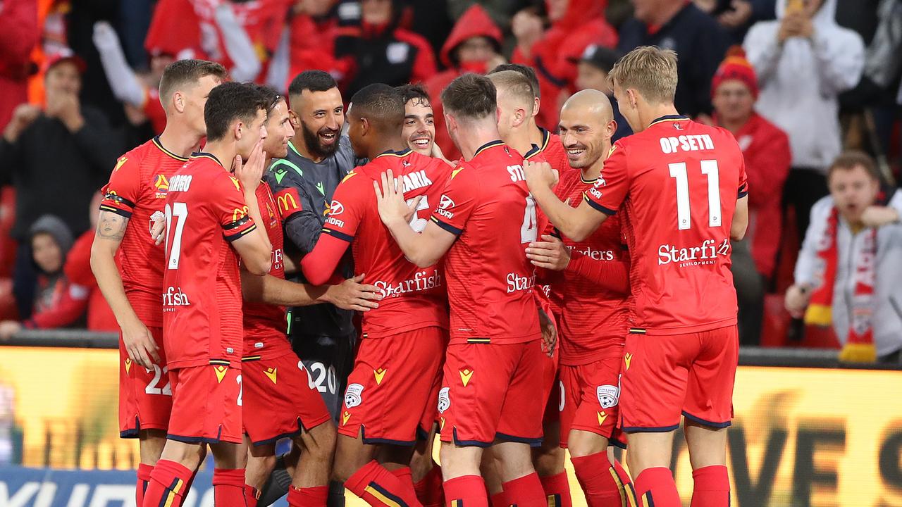 Adelaide mob Nikola Mileusnic after his cracking strike.