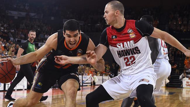 CAIRNS, AUSTRALIA – NOVEMBER 09: Fabijan Krslovic of the Taipans drives to the basket past Tim Coenraad of the Hawks during the round six NBL match between the Cairns Taipans and the Illawarra Hawks at the Cairns Convention Centre on November 09, 2019 in Cairns, Australia. (Photo by Ian Hitchcock/Getty Images)