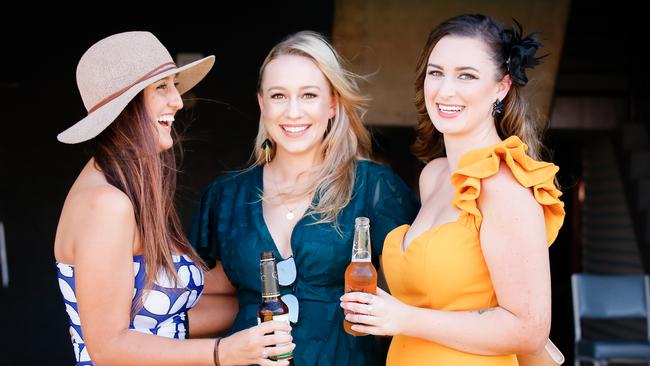 Charlotte Dubois, Hannah Makia and Tamika Andrews enjoying the Darwin Guineas at Fannie Bay Turf Club. Picture GLENN CAMPBELL