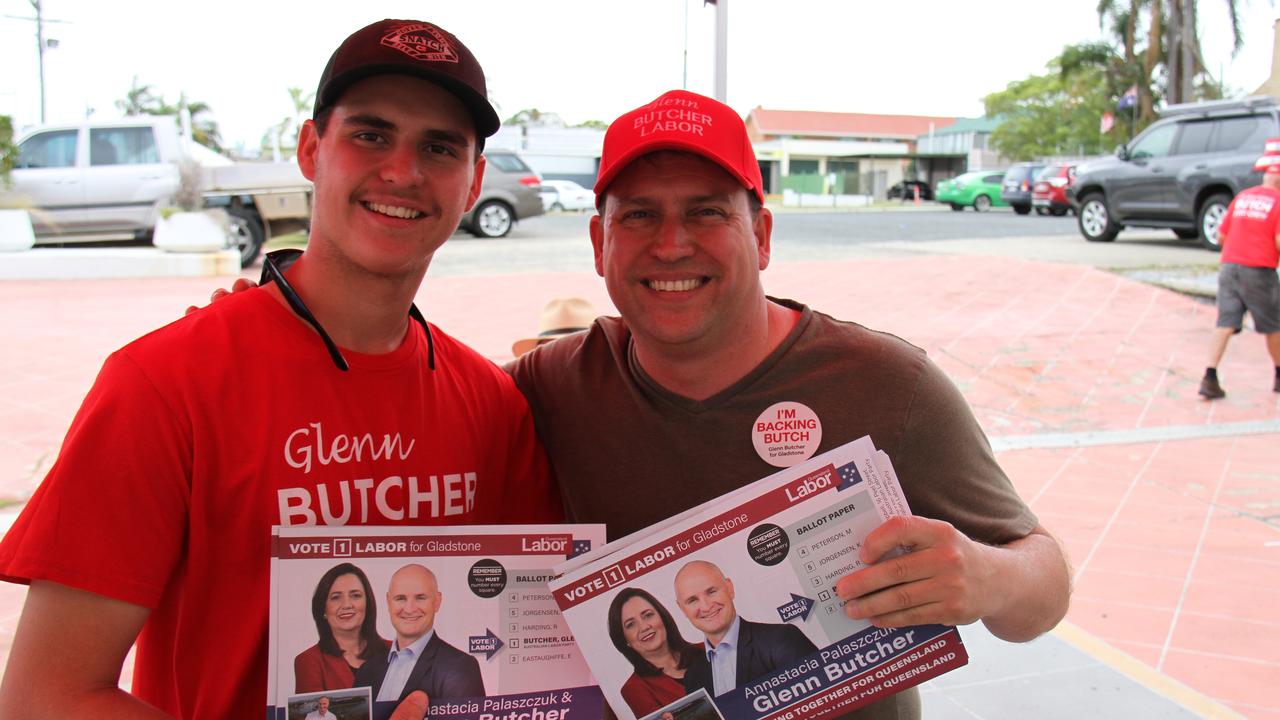 Josh Burnett and his father Gladstone Mayor Matt Burnett handing out how-to-vote information for Labor member for Gladstone Glenn Butcher at the Toolooa Street early voting booth. Picture: Rodney Stevens