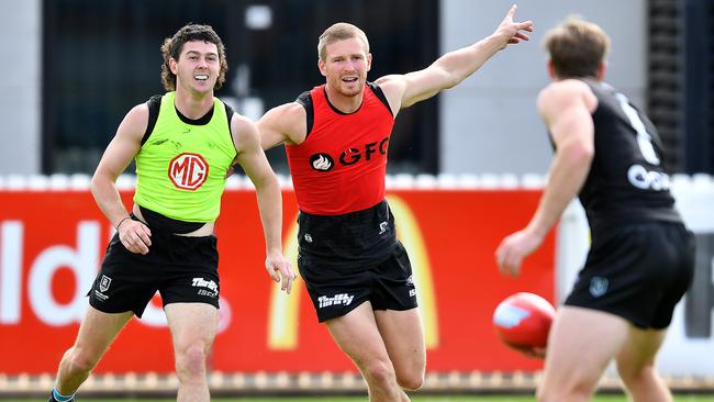 Darcy Byrne-Jones, Tom Clurey and Tom Jonas train as a defensive group. Picture: Mark Brake (Getty).