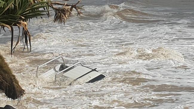 This Ute was the latest victim of the infamous Mudlo Rocks passing at Rainbow Beach, which was inundated with water when a large wave engulfed it on Tuesday morning.