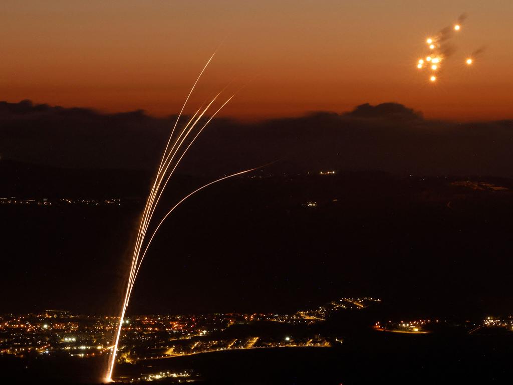 Rockets fired from southern Lebanon are intercepted by Israel's Iron Dome air defence system over the Upper Galilee region in northern Israel. Picture: Jalaa Marey/AFP