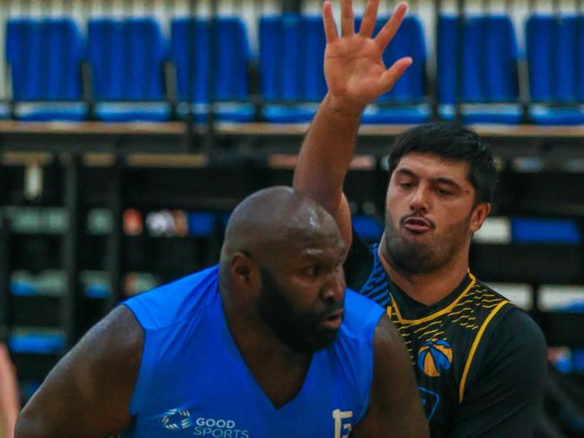 Ellas Titans’ Nathan Jawai against PaRBA’s Shquille Hohipa-Wilson. Picture: Glenn Campbell