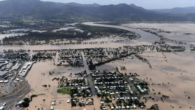 FILE PHOTO: Floodwaters resulting from ex-cyclone Debbie inundate parts of Rockhampton. (AAP Image/Dan Peled)