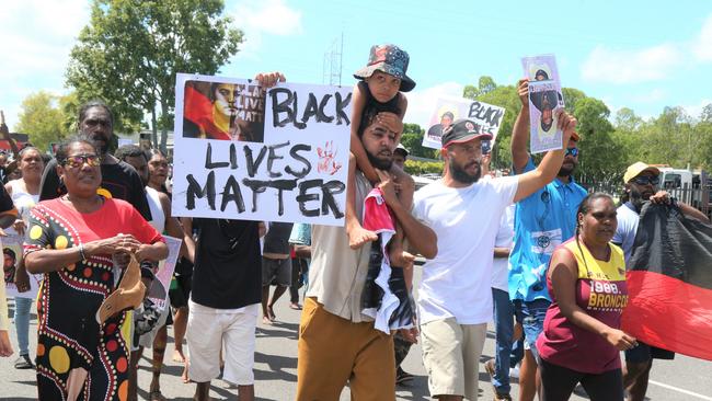 Algen Donahue leads a march through the streets of Mareeba after his twin brother was shot dead on Saturday. Picture: Peter Carruthers