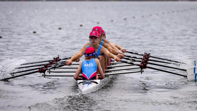 The All Hallows First VIII hard at rowing.