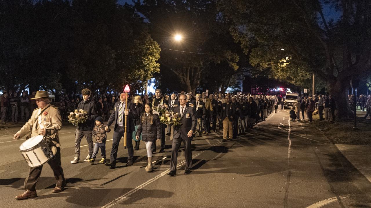 The march through the pre-dawn streets to Toowoomba's Anzac Day Dawn Service at the Mothers' Memorial, Thursday, April 25, 2024. Picture: Kevin Farmer