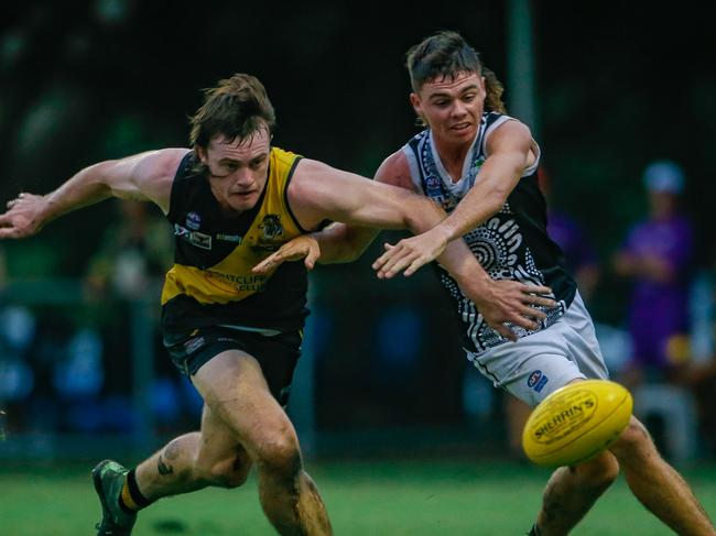 Palmerston’s Ryan Warfe (right) battles for possession with Nightcliff opposite Dom Brew during round 16 of the 2020-21 NTFL Premier League season. Picture: Glenn Campbell