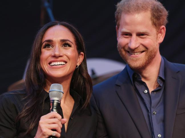 DUESSELDORF, GERMANY - SEPTEMBER 12: Prince Harry, Duke of Sussex and Meghan, Duchess of Sussex speak on stage at the "Friends @ Home Event" at the Station Airport during day three of the Invictus Games DÃÂ¼sseldorf 2023 on September 12, 2023 in Duesseldorf, Germany. (Photo by Chris Jackson/Getty Images for the Invictus Games Foundation)