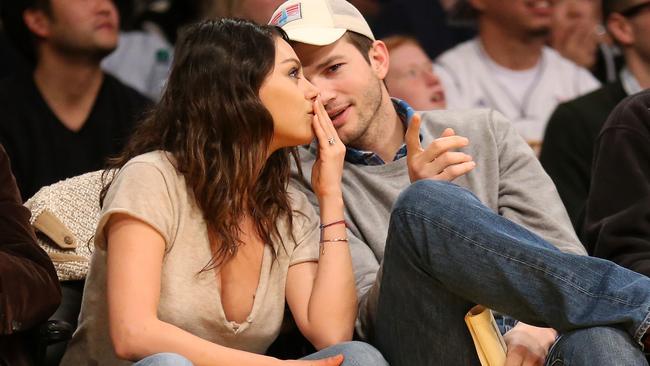 Ashton Kutcher and Mila Kunis at Staples Center in Los Angeles.