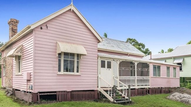 The "Pink House'' in Yeronga was bought by a developer who plans to raise the house and move a pre-1911 home next to it.