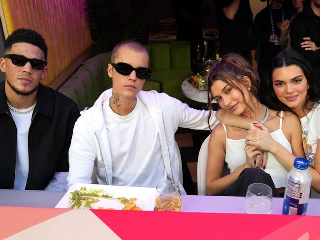 Celeb couple Devin Booker (left) and Kendall Jenner (right) with Justin and Hailey Bieber. Picture: Kevin Mazur/Getty Images for Roc Nation