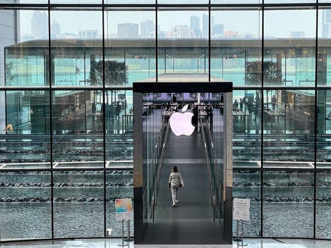 A shopper enters the Apple Inc. store in The Galleria shopping complex on Al Maryah Island in Abu Dhabi, United Arab Emirates, on Sunday, April 10, 2022. Abu Dhabi regulators approved a framework for special purpose acquisition companies, looking to capture some of the blank-check boom that has gripped global markets for the past two years. Photographer: Christopher Pike/Bloomberg