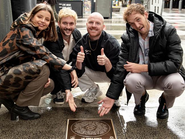 The Jungle Giants unveil their Queensland Music Awards 2020 Song of the Year plaque in the Valley Walk of Fame before the 2021 ceremony. They won for the track Heavy Hearted.