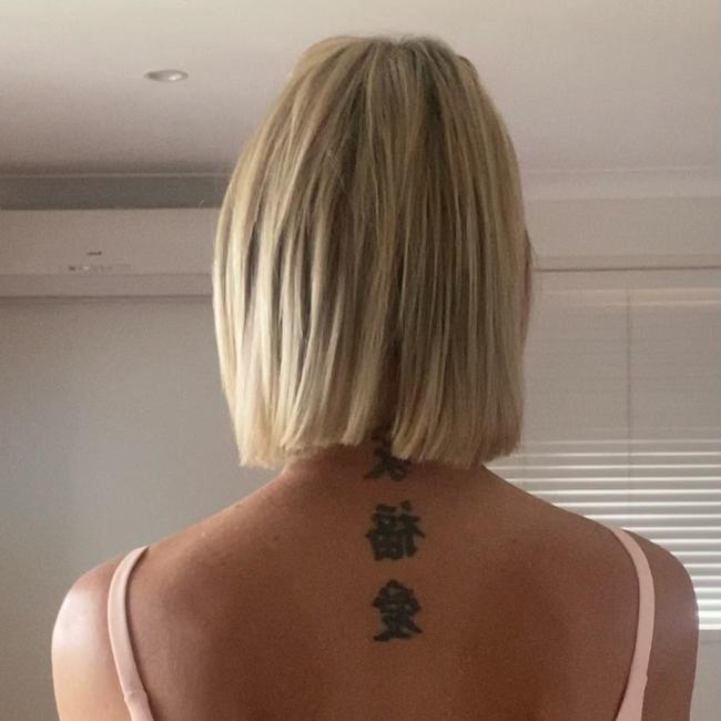Katie Hally’s tattoos mean 'Family, Love & Happiness' in Chinese hanzi characters. Picture: Supplied