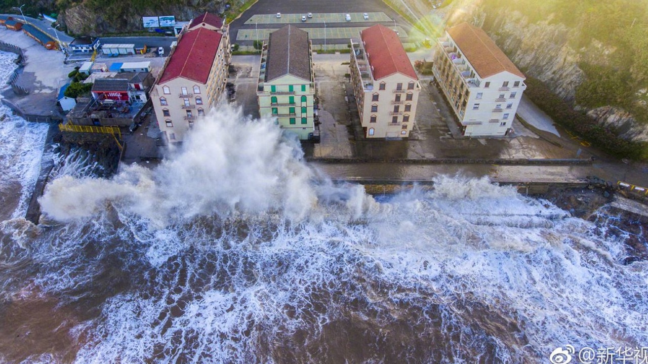 Typhoon Maria strikes the coast of China today, sending waves crashing into beachside resorts. Picture: Xinhua