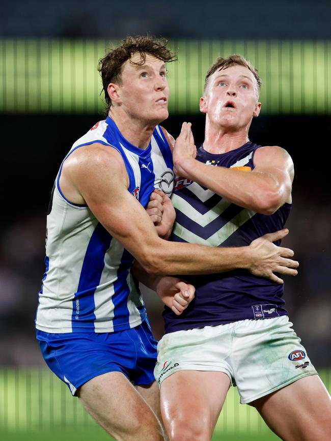 Nick Larkey of the Kangaroos and Josh Treacy of the Dockers compete in a ruck contest. Picture: Dylan Burns/AFL Photos via Getty Images.