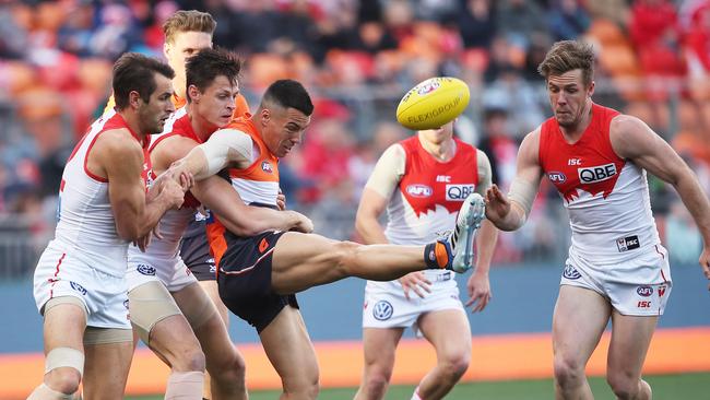 Giant Dylan Shiel gets a kick away against the Swans. Picture. Phil Hillyard