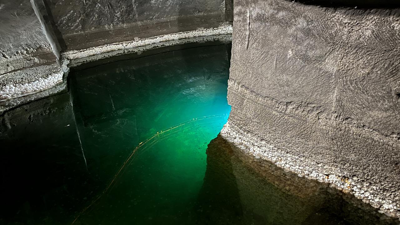 Illuminated water underground at the Wieliczka Salt Mine in Poland, an ‘optional’ on the trip. Picture: Alex Turner-Cohen/news.com.au