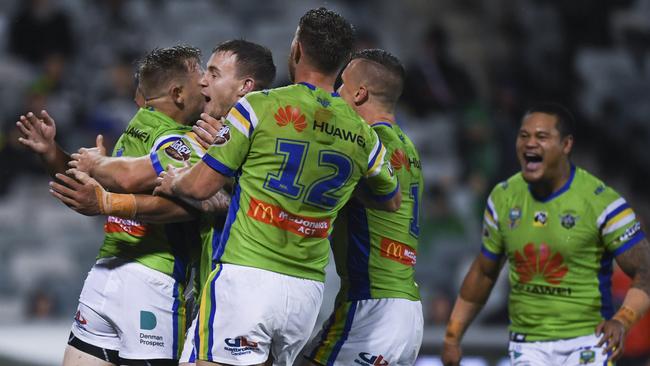 Blake Austin celebrates scoring a try wotj jos Raiders teammates.