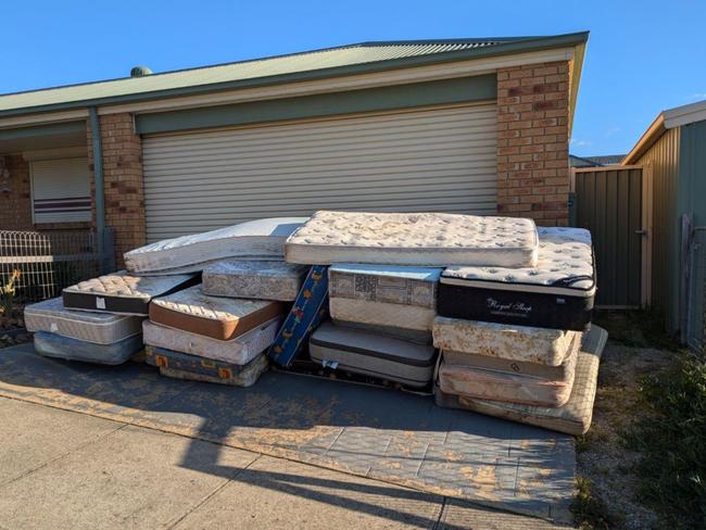 A person in Melbourne says over two dozen mattresses were dropped on their driveway after disputing a rubbish clean-up bill.