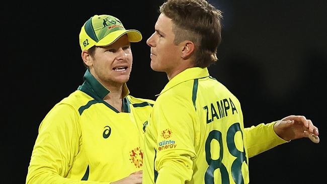 Adam Zampa is congratulated by Steve Smith after dismissing Liam Dawson. Picture: Cameron Spencer/Getty Images