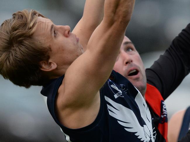 Mornington Peninsula FNL : Frankston Bombers v Edithvale-Aspendale at Baxter Park. The Bombers led at the last change but the Eagles finished strongly to win. Edithvale-Aspendale #15 Charlie Martello keeps his eye on the ball.  Picture: AAP/ Chris Eastman