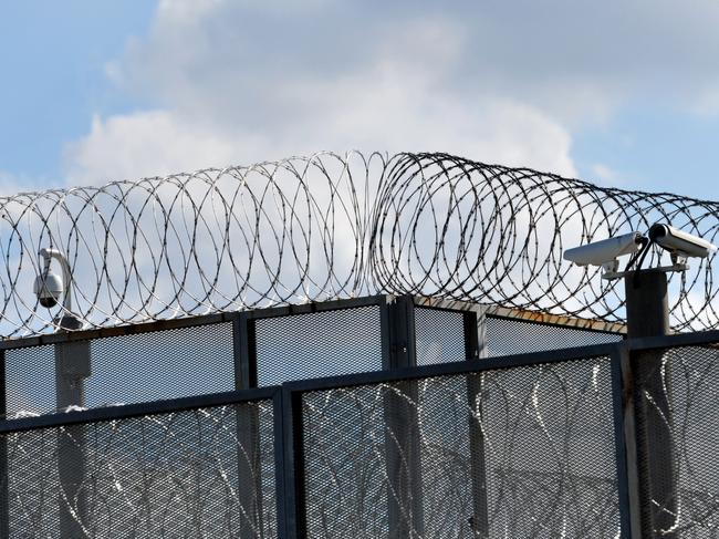 The perimeter fence at Silverwater jail in Sydney's west, Monday, April 1, 2013. Two prisoners have been found dead in a cell at Silverwater jail during an inspection early today. (AAP Image/Paul Miller) NO ARCHIVING