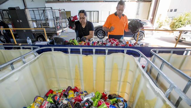 Containers for Change collection point at 3/9 Christensen Rd, Staplyton was open Thursday. Owner Damien Wooford and worker Totai Tunui. Picture: Jerad Williams