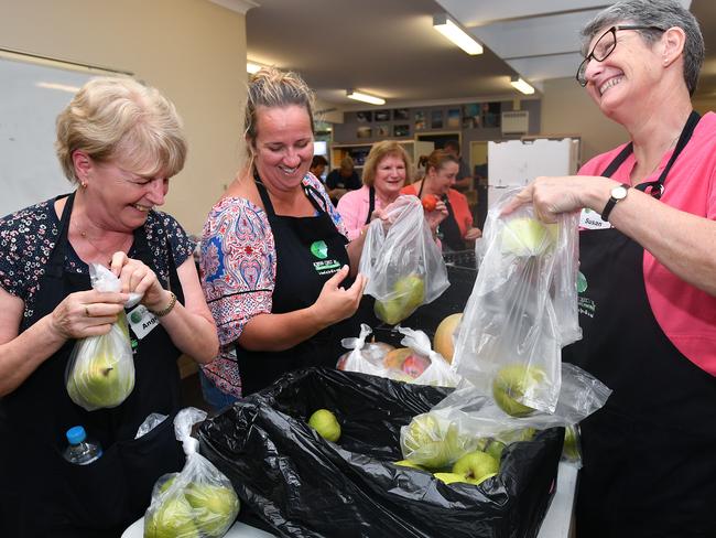 Volunteers Angela McCabe and Susan Hunter packing fresh produce for clients at the Hornsby Connect. Picture: Joel Carrett