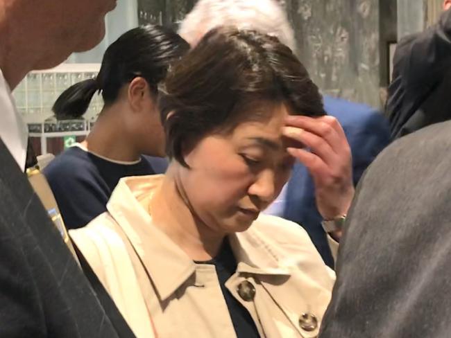 Emperor Garden waitress and ‘straw donor’ Patricia Siu leaves ICAC with investigators and solicitor to retrieve documents from her home. Picture: Clarissa Bye