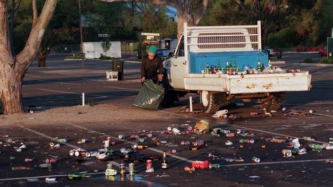 Helen Campbell, 82, cleans up the Flemington carpark after the last race in 1997.